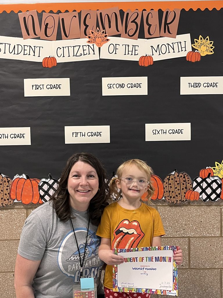 Photograph of student and citizen of the month award with teacher and students.