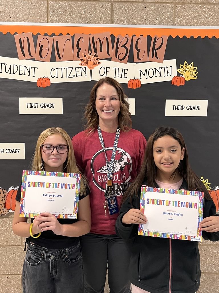 Photograph of student and citizen of the month award with teacher and students.