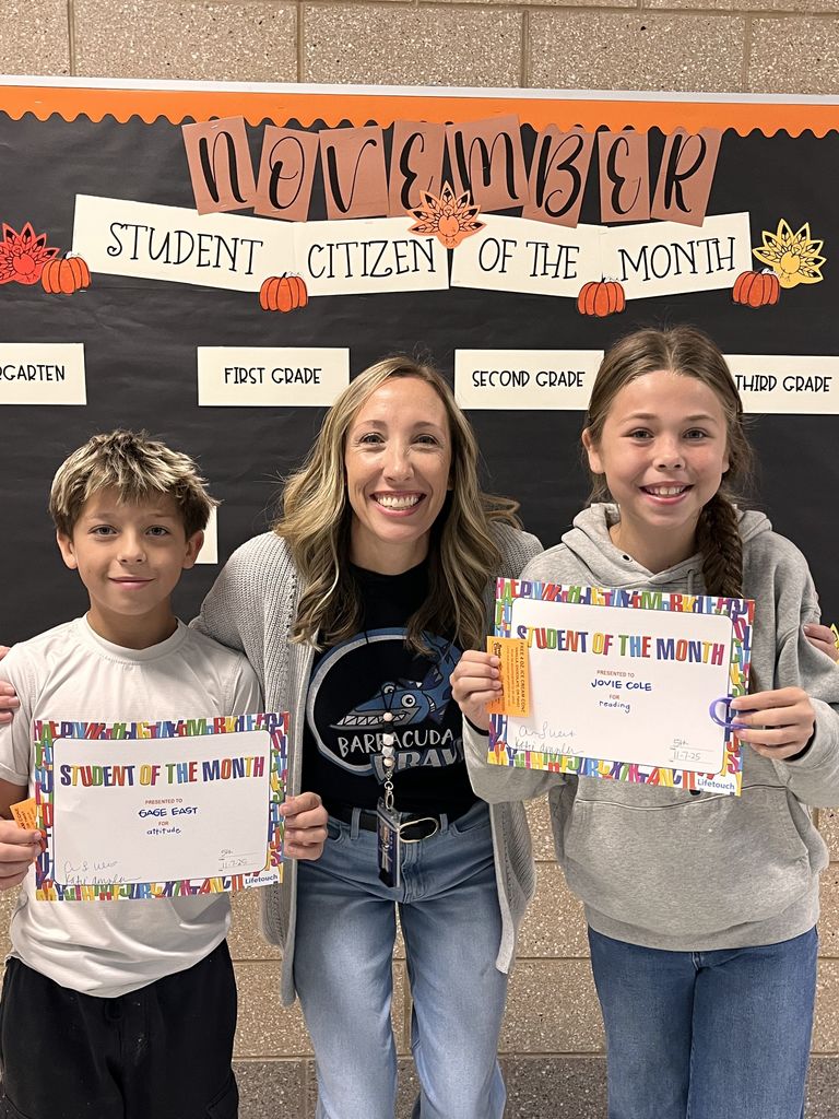Photograph of student and citizen of the month award with teacher and students.