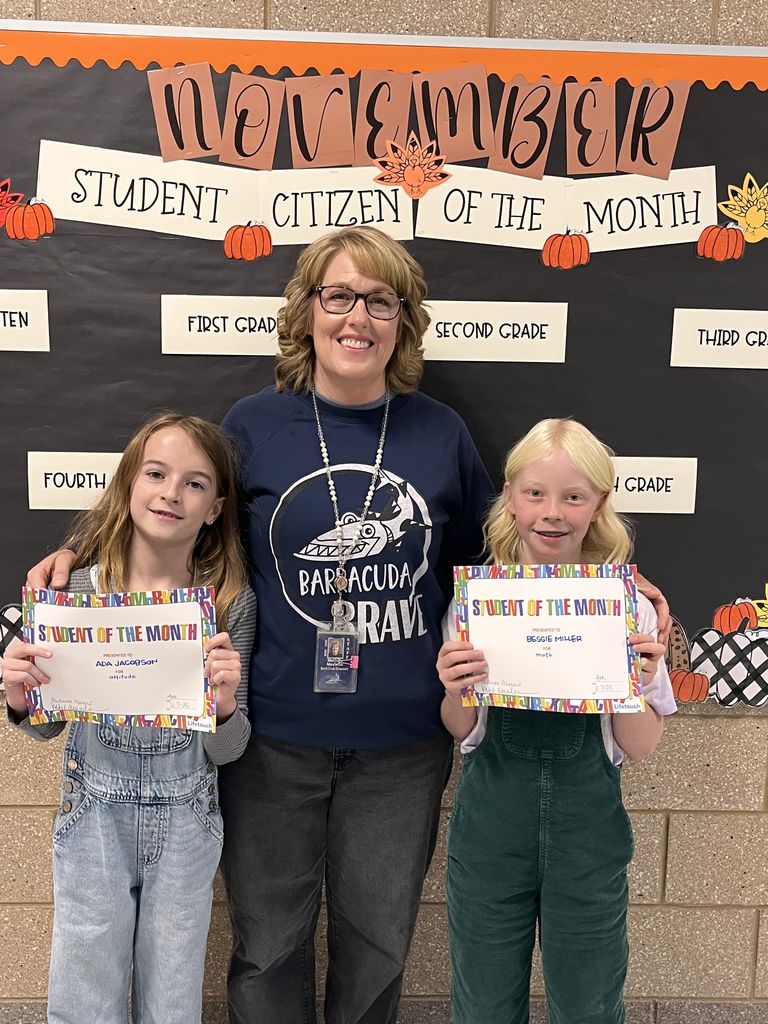 Photograph of student and citizen of the month award with teacher and students.