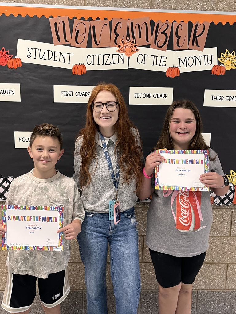 Photograph of student and citizen of the month award with teacher and students.