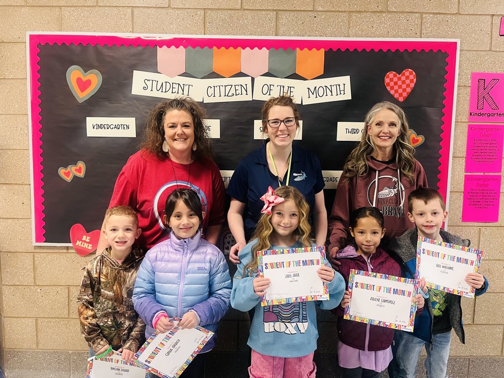 Photograph of student and citizen of the month award with teacher and students.