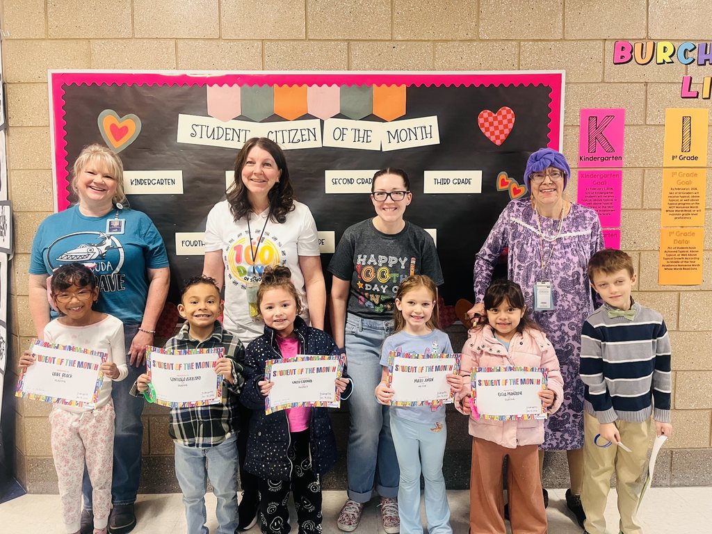 Photograph of student and citizen of the month award with teacher and students.