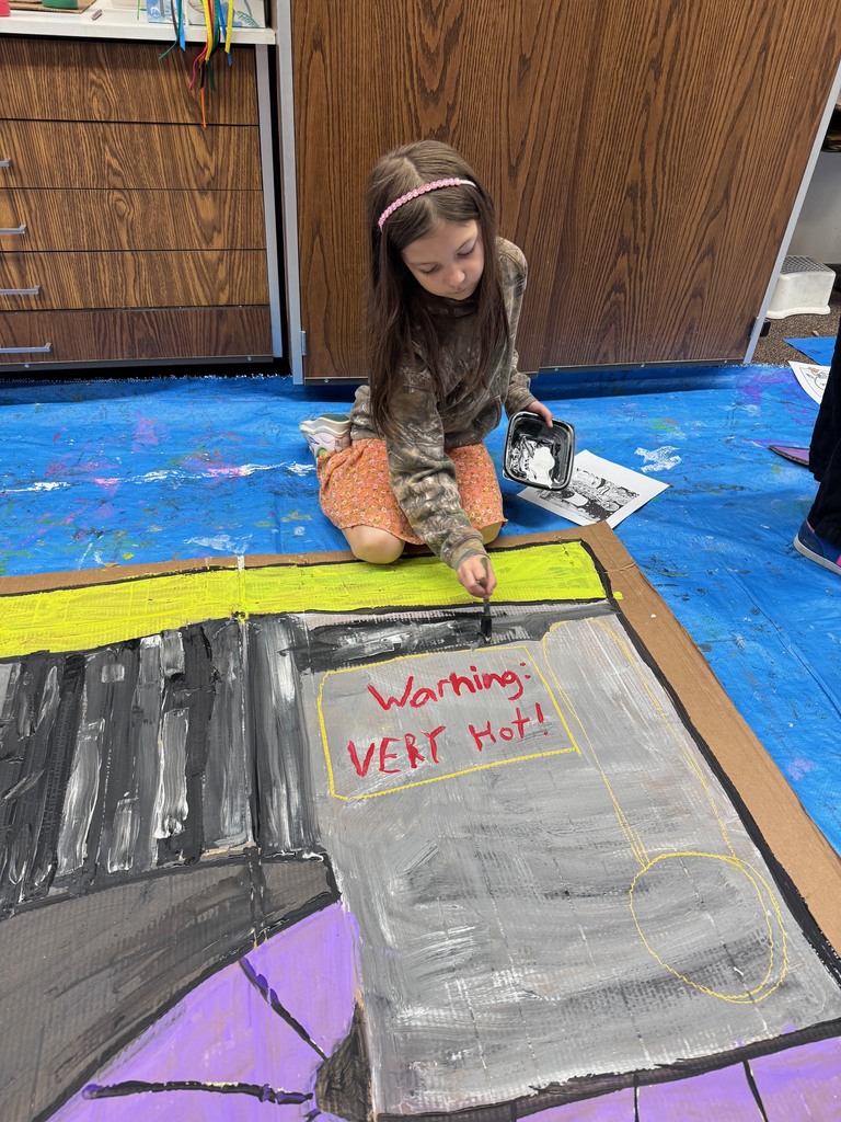 Art club painting scenery for upcoming Opera performance.