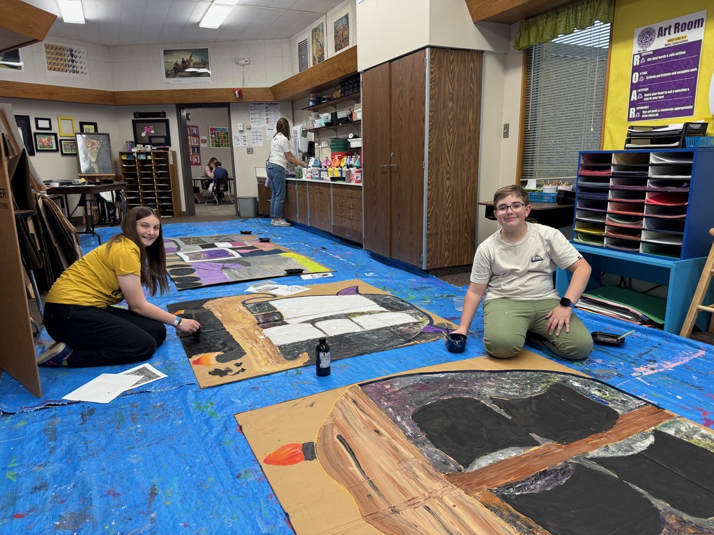 Art club painting scenery for upcoming Opera performance.