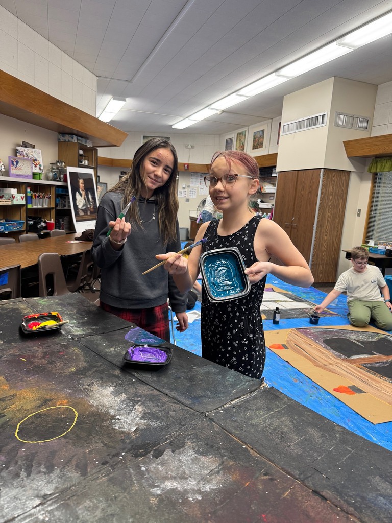 Art club painting scenery for upcoming Opera performance.