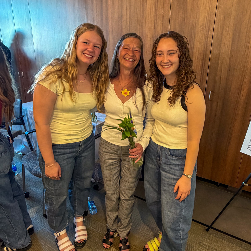 Students creating daffodil arrangements and delivering them