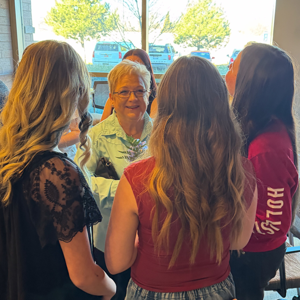 Students creating daffodil arrangements and delivering them