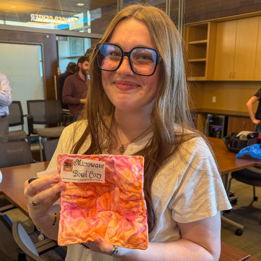 Students creating daffodil arrangements and delivering them