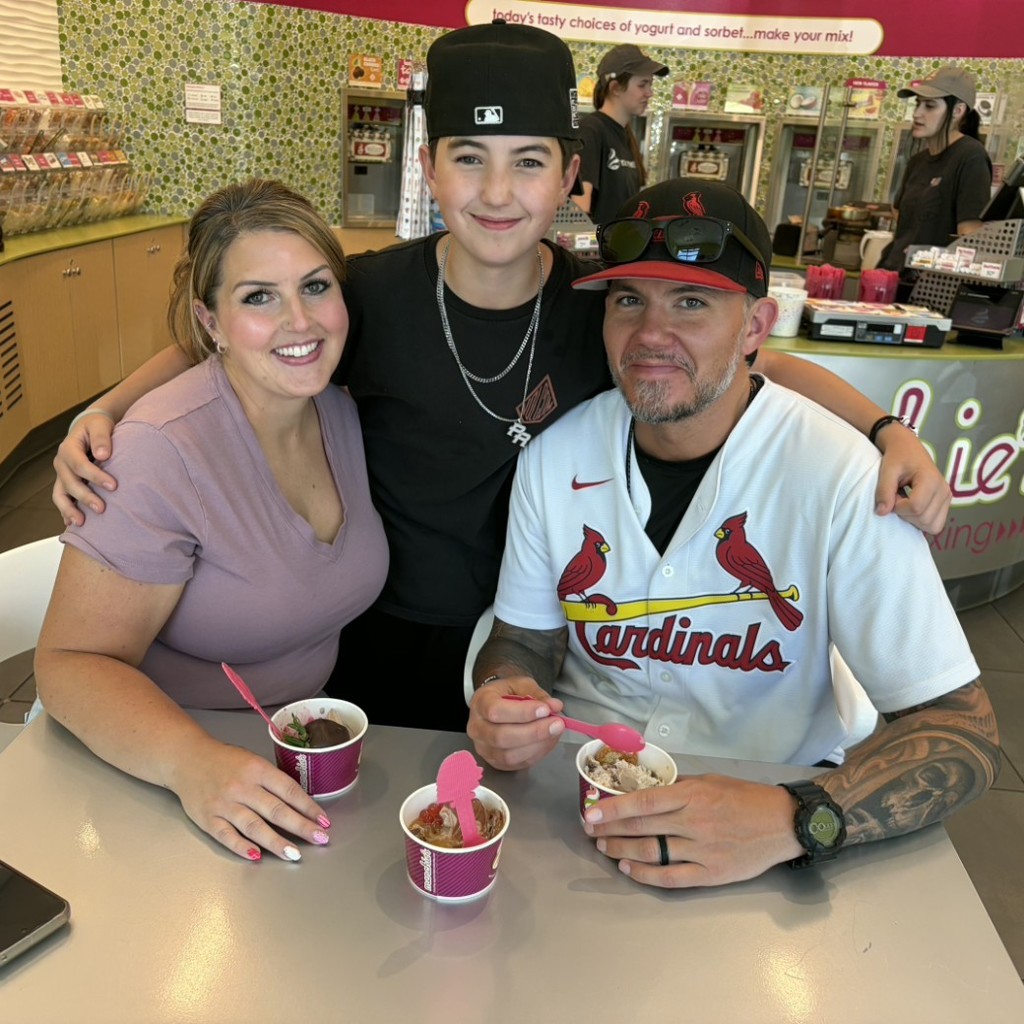 A boy and his parents eating Menchies 