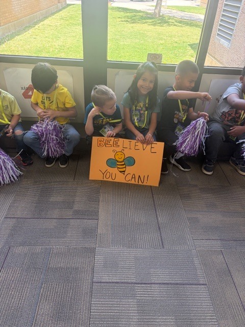 Some of our kindergarteners with their poster
