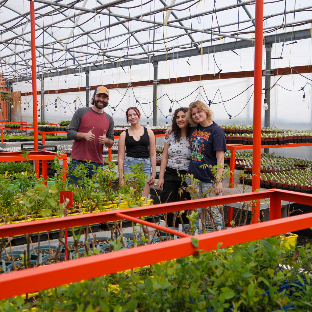 Students in greenhouse.