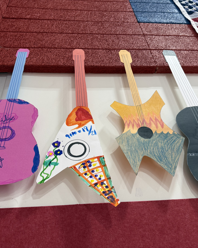 A vibrant series of clips showing students smiling and collaborating on colorful watercolor paintings. The scenes highlight their creative process and finished artwork made possible by Mrs. Reese and the BTS Foundation