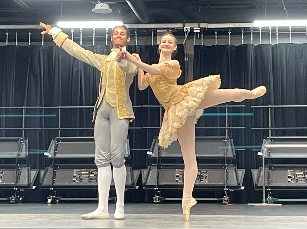 two ballet dancers in full costume in a pose 