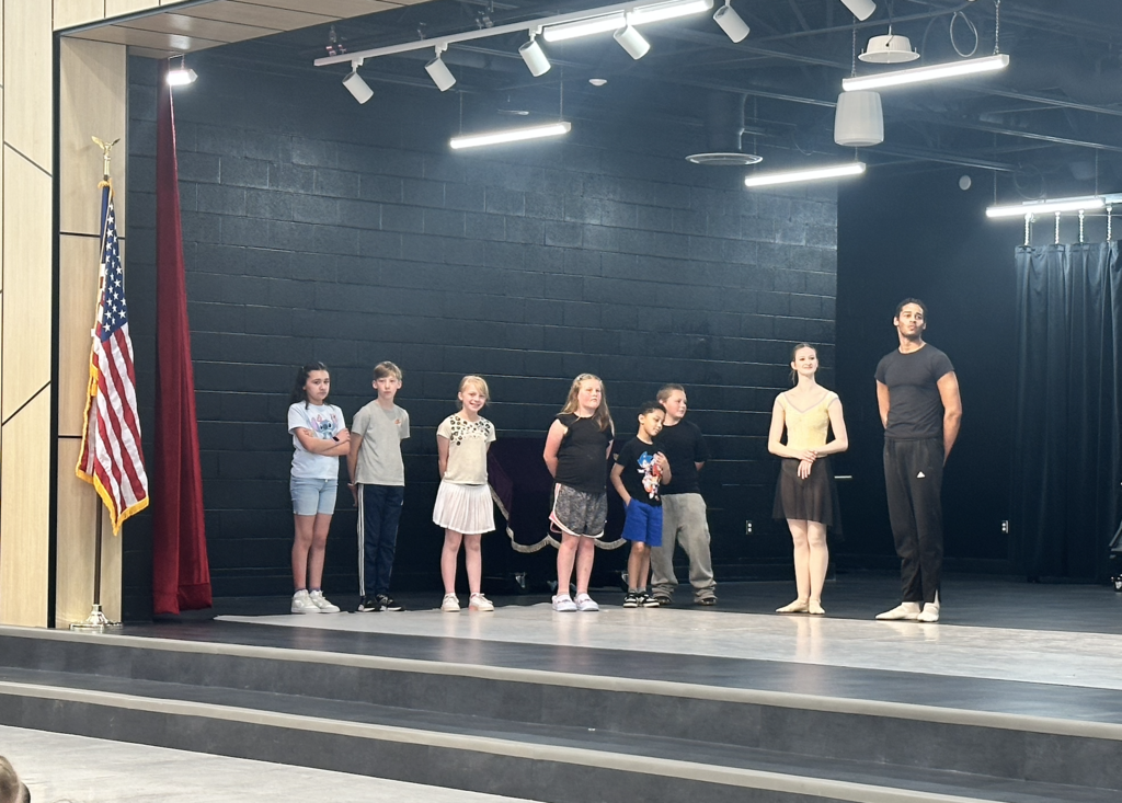 students getting ready to participate with the ballet dancers