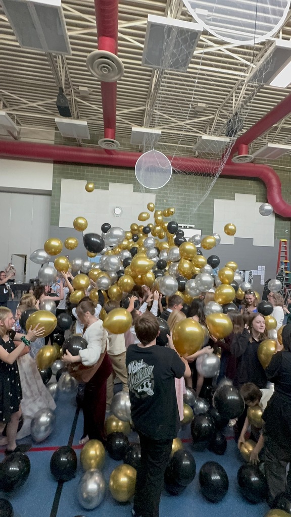 6th grade dance photos- thousands of balloons drop on the dance