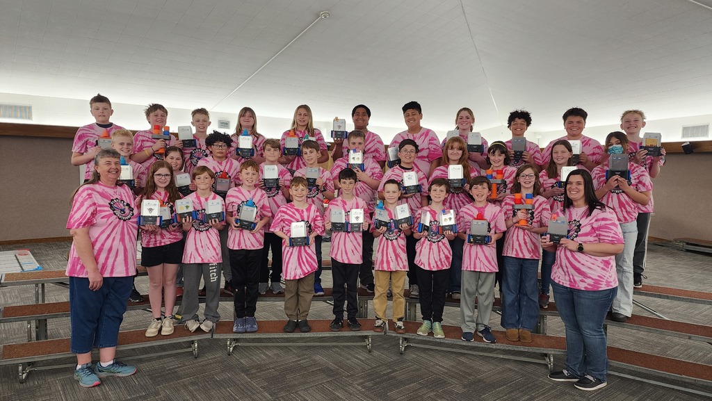 Pioneer Roadrunners posing for the camera with their trophies