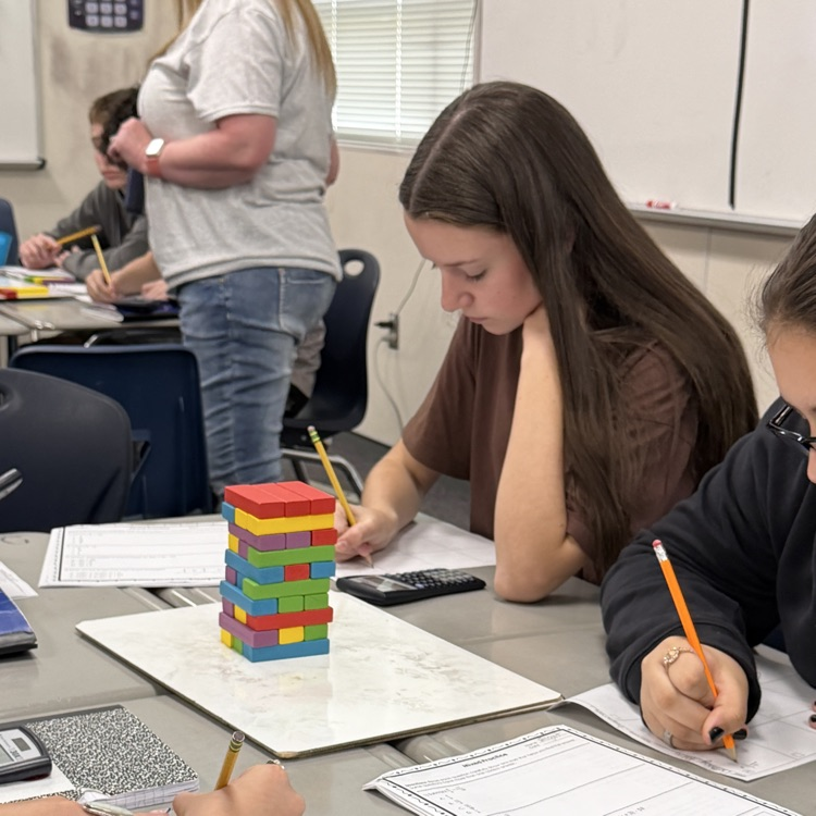 students playing jenga