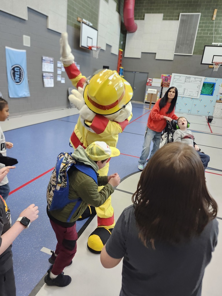 Weber Fire Presentation assembly. Life Skills Students dancing with the Dalmatian
