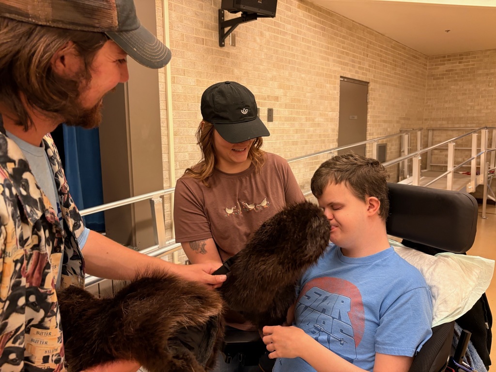 Students trying on Beaver Skin Gloves