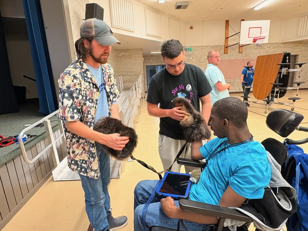 Students trying on Beaver Skin Gloves