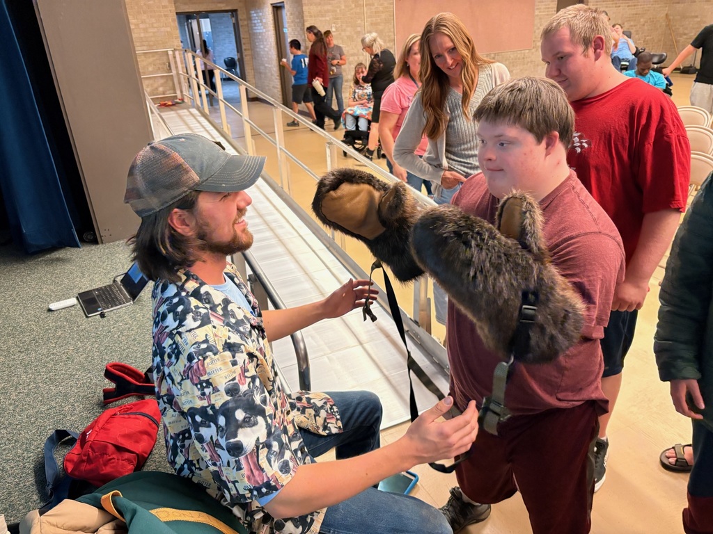 Students trying on Beaver Skin Gloves