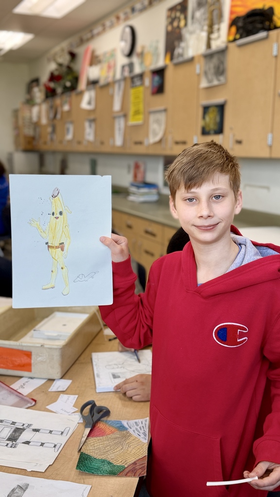 Kids prepping art show presentations.