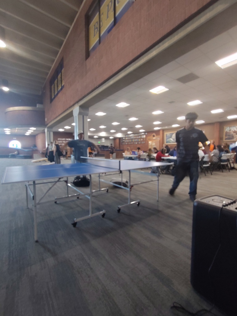 Students playing ping-pong.