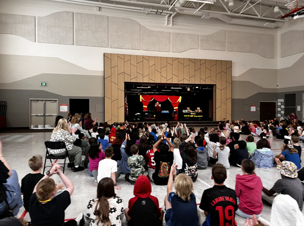 students in an assembly for a magic show