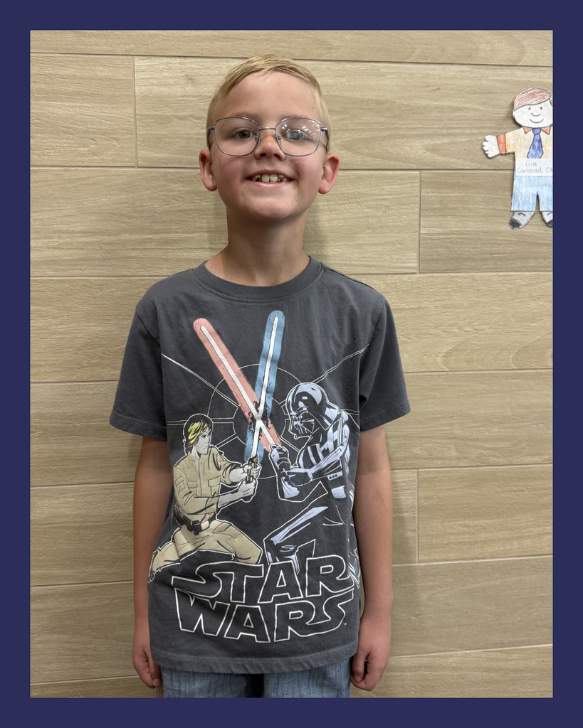 Student smiling wearing Star Wars shirts in celebration of...May the 4th Be With You! 