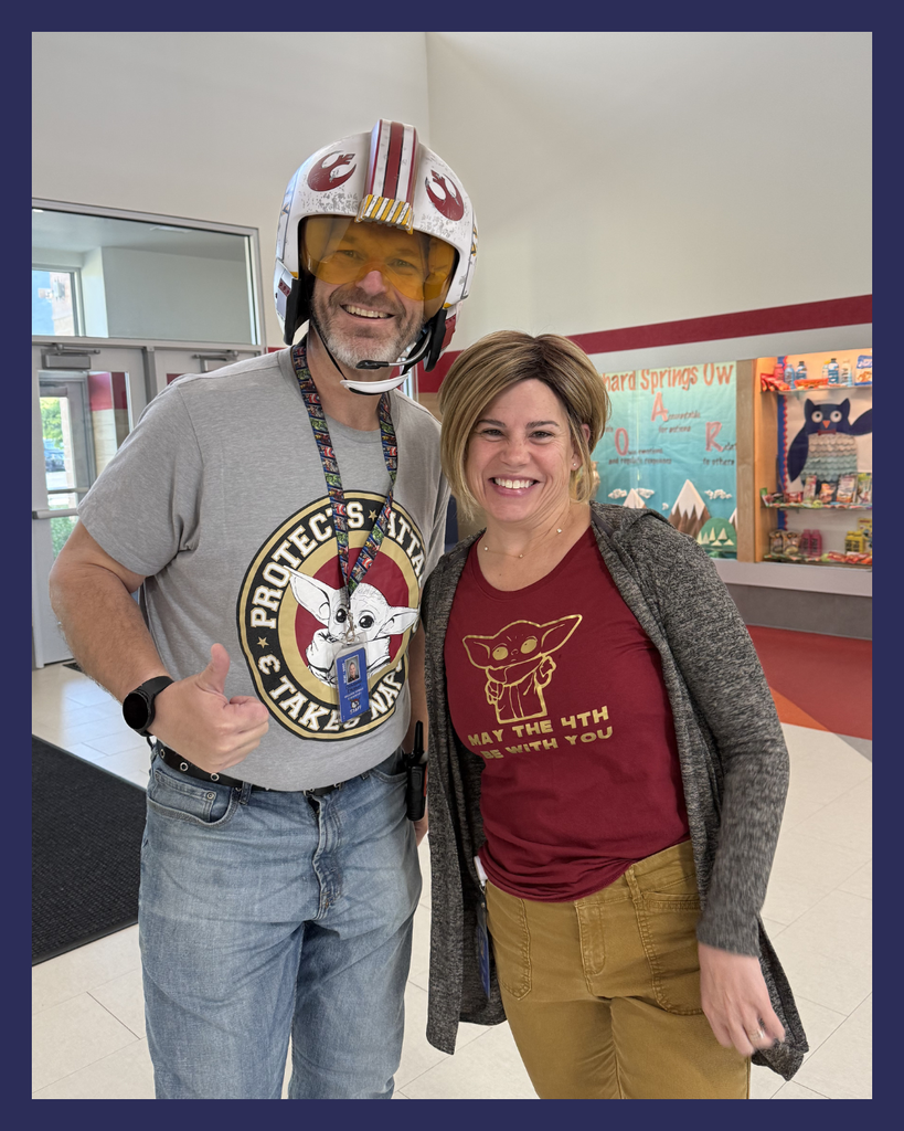 Two teachers smiling wearing Star Wars shirts in celebration of...May the 4th Be With You! 