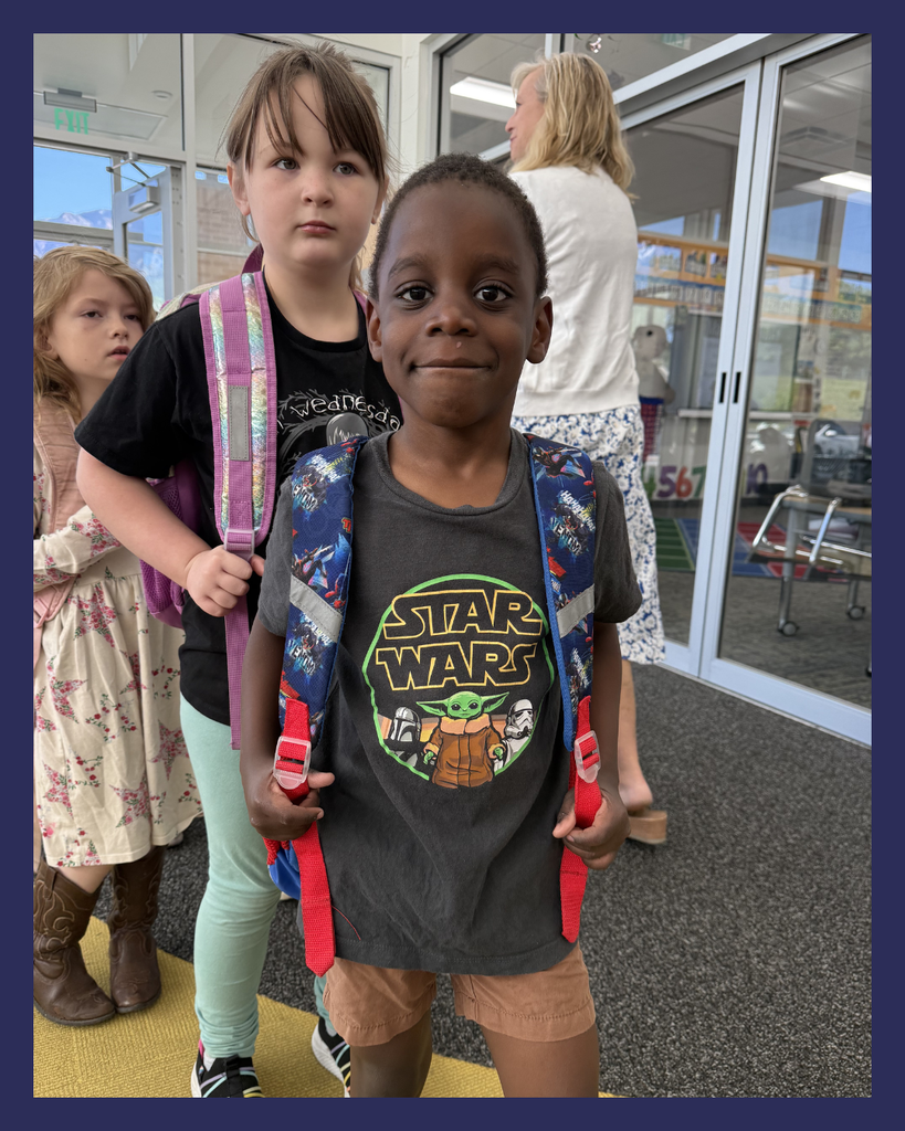Student smiling wearing Star Wars shirts in celebration of...May the 4th Be With You! 
