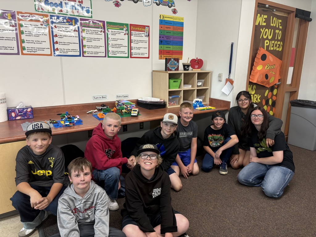 students smiling with lego