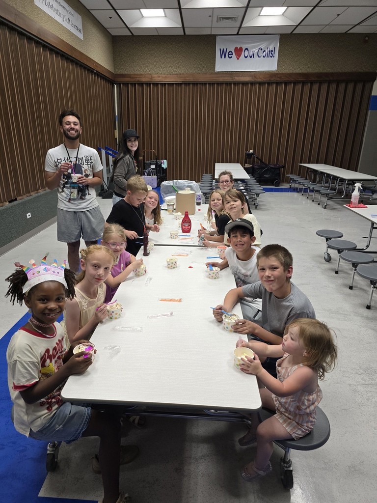 Winners eating ice cream with Mr. Drew
