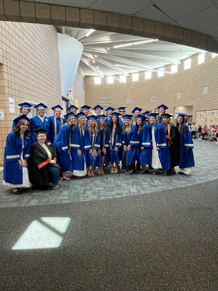 group of high school graduates smiling together 