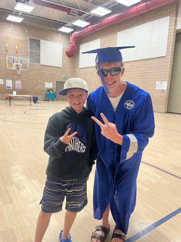 plain city student smiling with a fremont graduate 