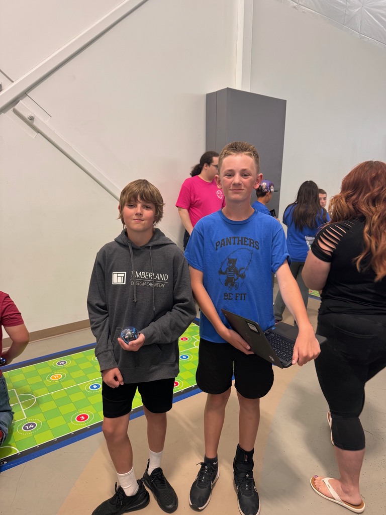 two students smiling at the olympiad
