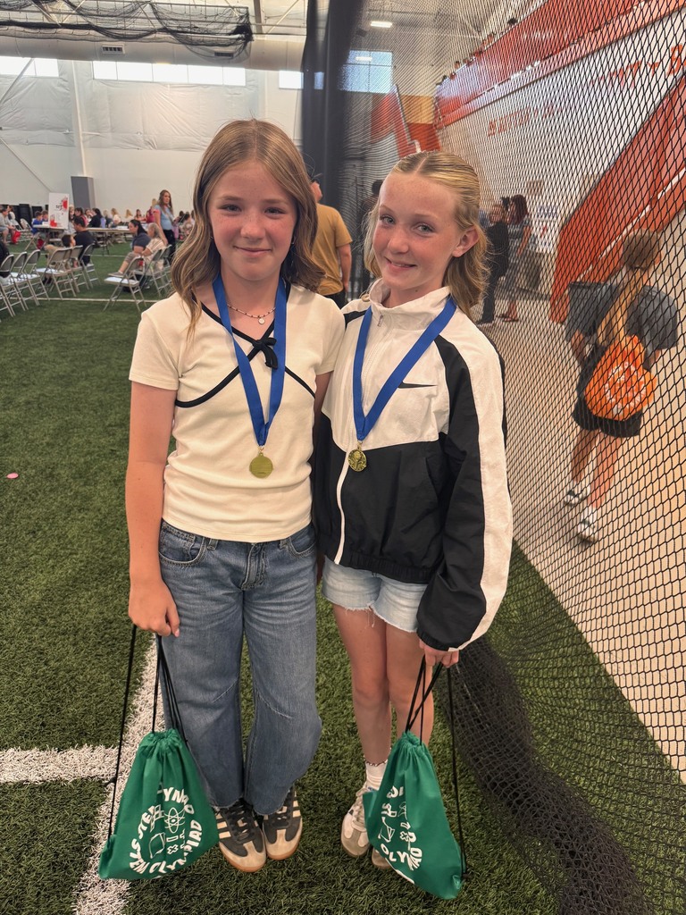 two plain city panthers smiling with their medals