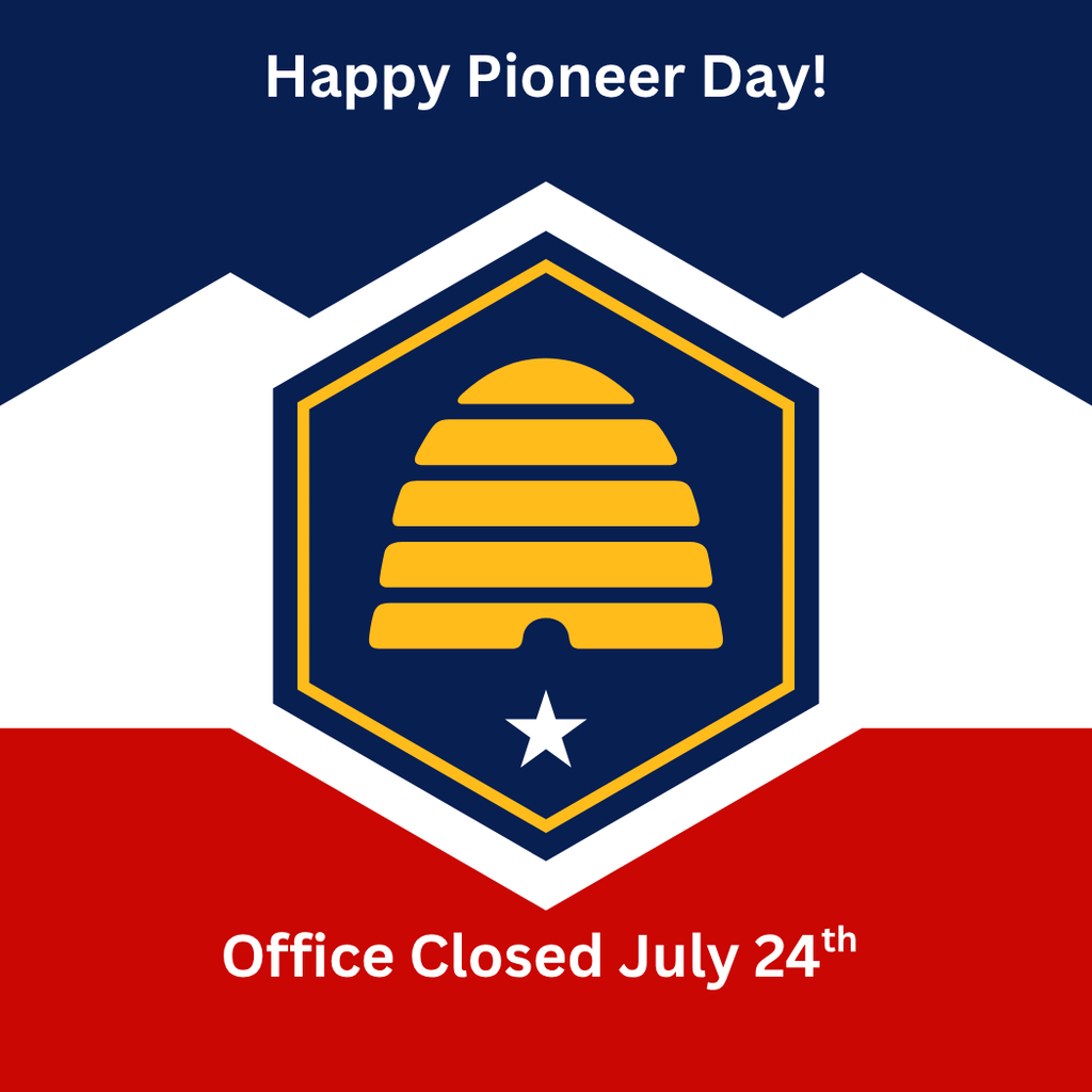 A graphic celebrating Pioneer Day against a background inspired by the Utah state flag, featuring a top dark blue section, a middle white section with mountain peaks, and a red bottom section. At the top, white text reads "Happy Pioneer Day!" In the center is a large dark blue hexagon outlined in white and gold, containing a gold beehive symbol and a five-pointed white star below it. At the bottom, white text reads "Office Closed July 24th".