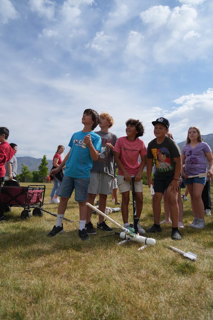 Sixth-graders launching the rockets they build through a hands on learning experience. 