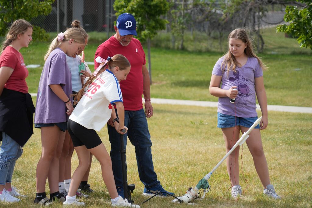 Sixth-graders launching the rockets they build through a hands on learning experience. 