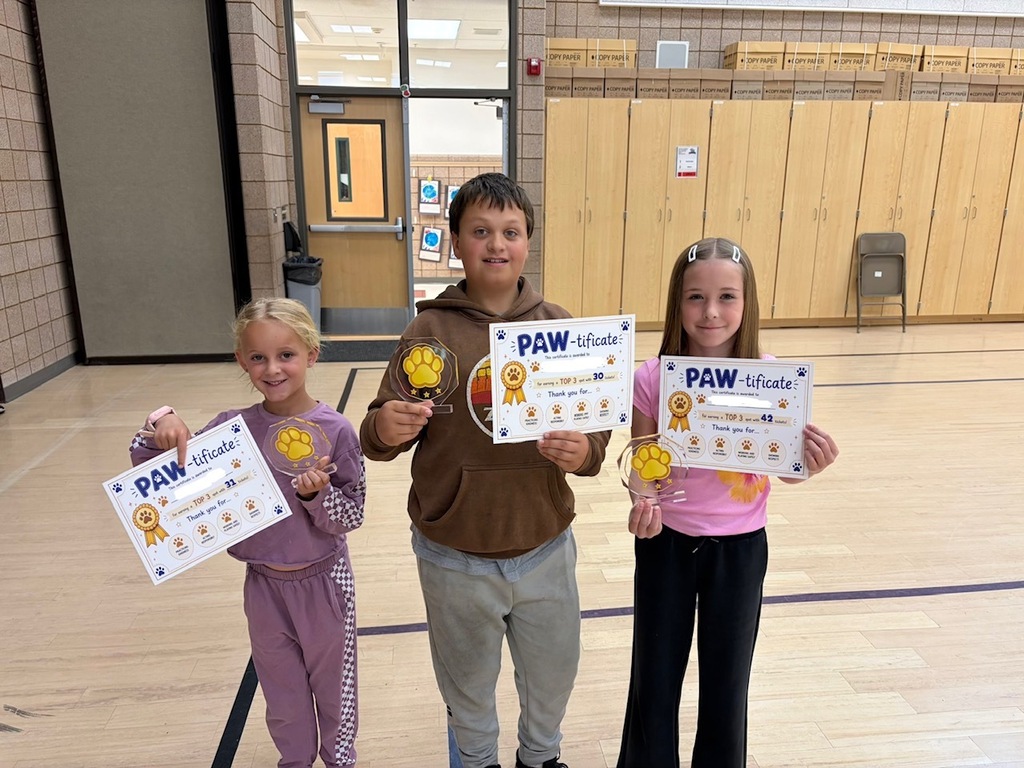 students smiling with rewards/ paw-tificates