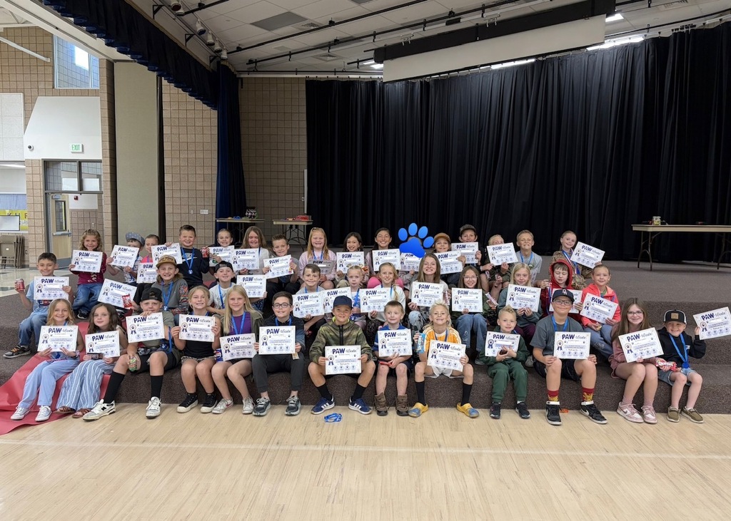 students smiling with rewards/ paw-tificates