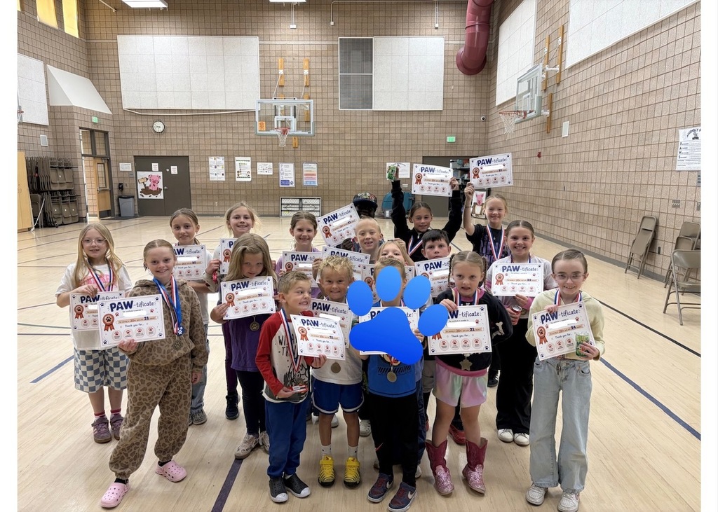 students smiling with rewards/ paw-tificates