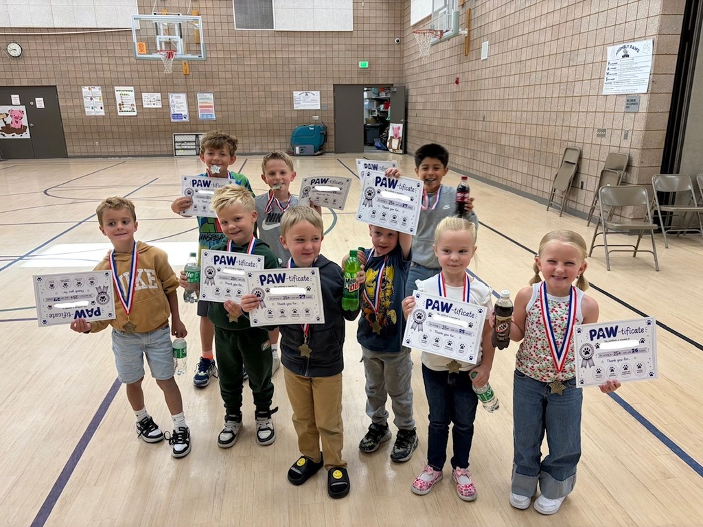 students smiling with rewards/ paw-tificates