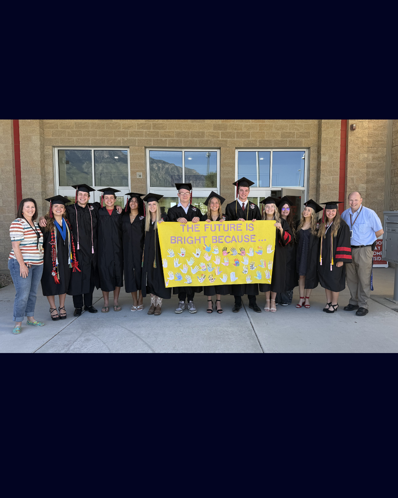 Group of graduates with their teachers. 