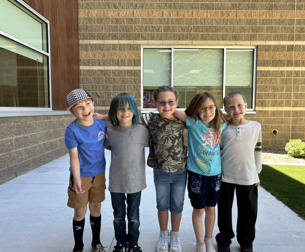 a group of 5 students standing together