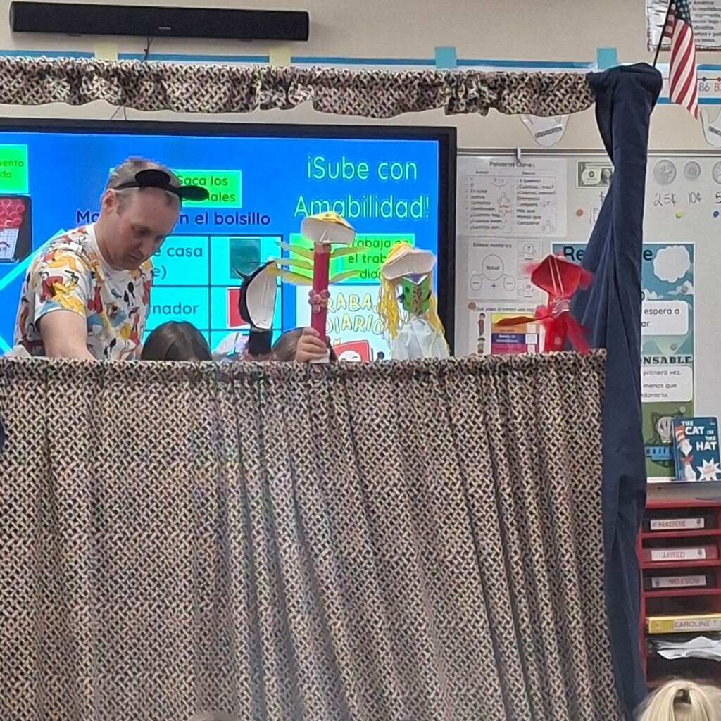 puppets in a puppets show. Sr. Findlay helping.