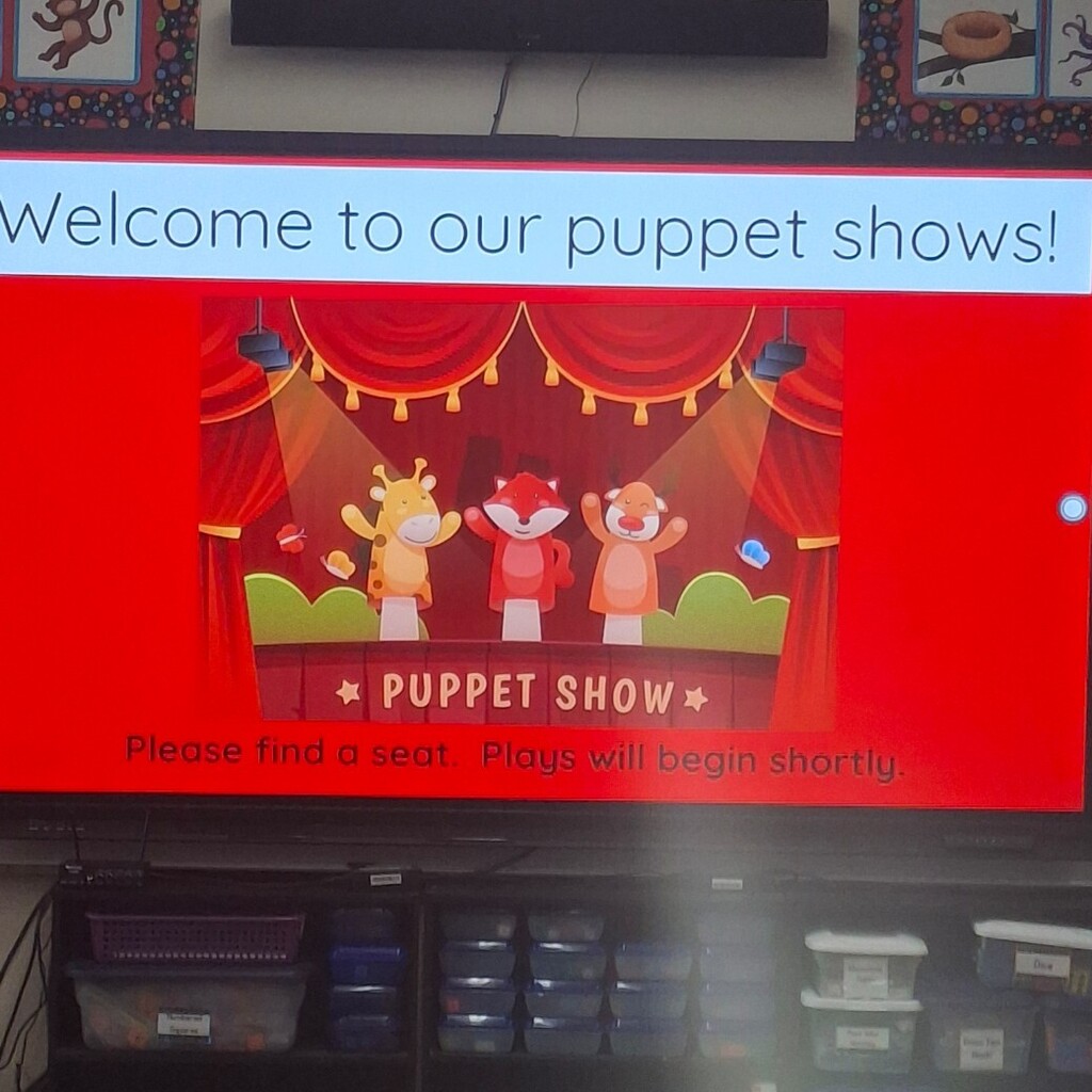 sign that says welcome to our 2nd grade puppet shows.