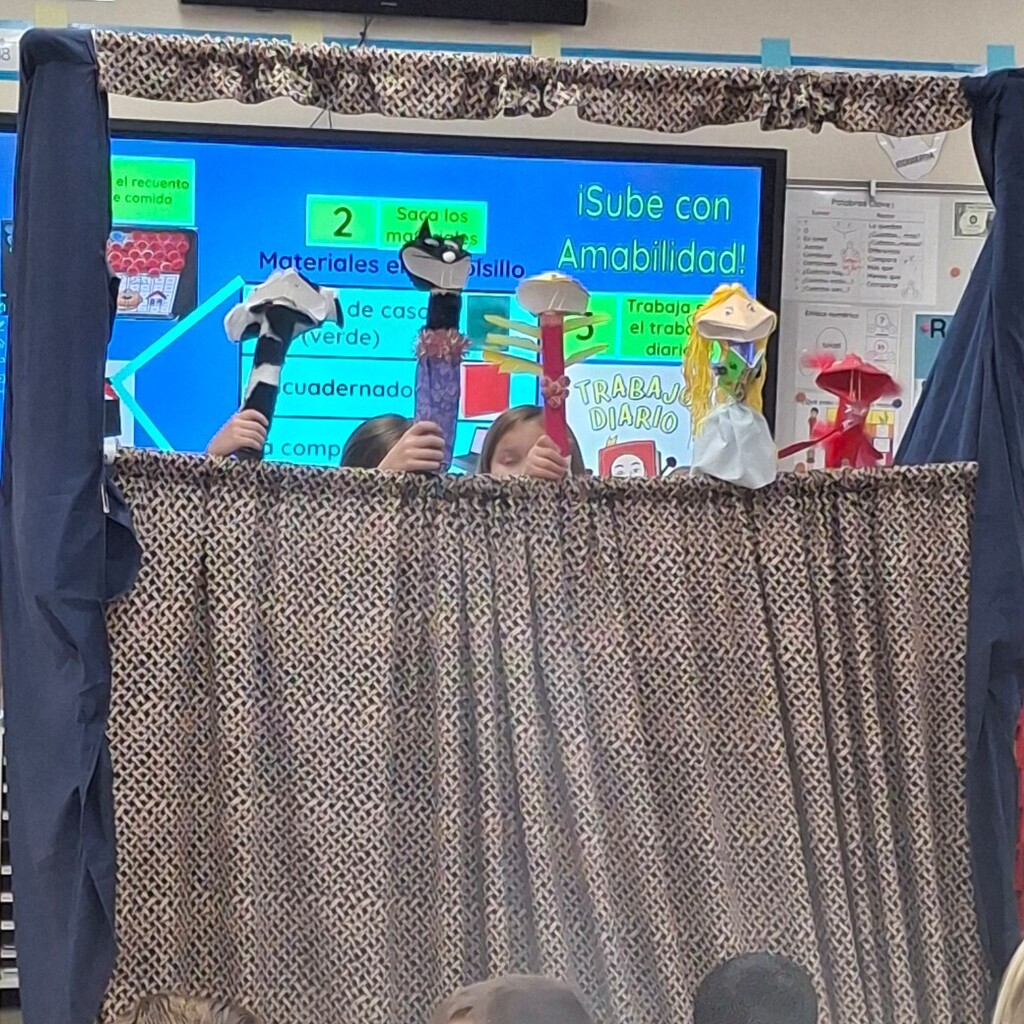 Kids performing their puppets show.